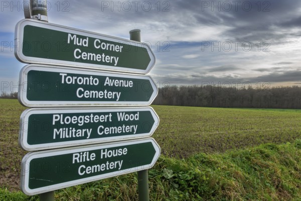 Signposts showing directions to different WW1 military cemeteries on former World War One battlefield at Ploegsteert, Plugstreet, Hainaut, Belgium, Europe