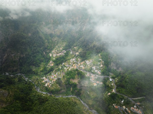 Aerial drone view of Curral das Freiras village in Valley of the Nuns from Miradouro da Eira do Serrado, Madeira island, Portugal, Europe