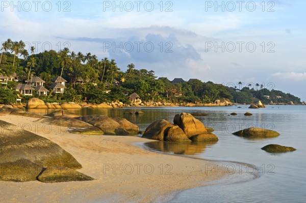 Sandy beach beach with boulders in the evening light, Koh Samui, Thailand, Asia