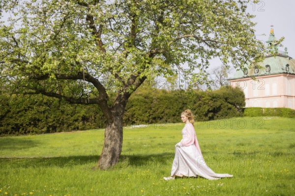 Cinderella can also be seen around Moritzburg Castle in spring. Model Tamara Kretschmer once again slipped into the coveted role of the legendary Cinderella with the ball gown, Moritzburg, Saxony, Germany, Europe