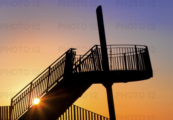 Viewing platform of the Pluto spoil tip at atmospheric sunset, Herne, Ruhr area, North Rhine-Westphalia, Germany, Europe