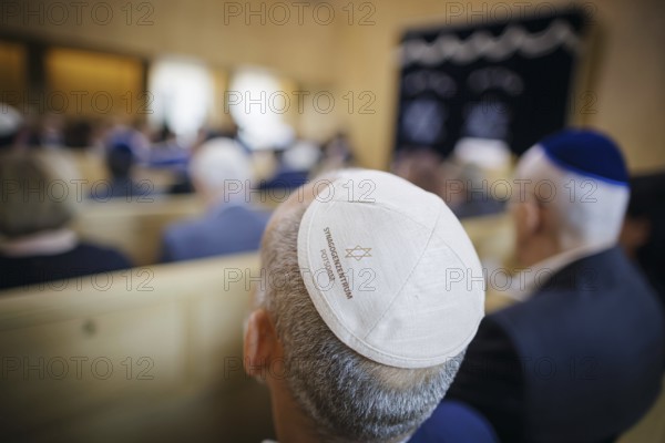 A man with a kippah sits in the synagogue during the inauguration of the synagogue centre in Potsdam. Berlin, 04.07.2024