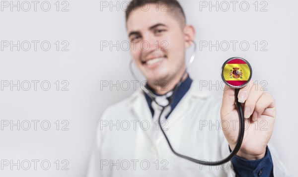 Smiling doctor holding stethoscope with Argentina flag isolated. Argentine Health and Care concept