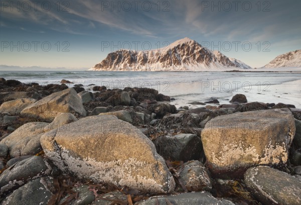 Winter evening mood at Skagsanden, rocks and beach near Flakstad, Flakstadøy, Lofoten, Nordland, Norway, Europe