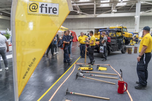 Information stand of the aid organisation @Fire, which helps worldwide in the event of disasters, earthquakes, forest fires, the Interschutz 2022 trade fair in Hanover, the world's largest trade fair for fire, rescue and disaster control technology, equipment, over 1300 exhibitors from 50 countries, disaster control