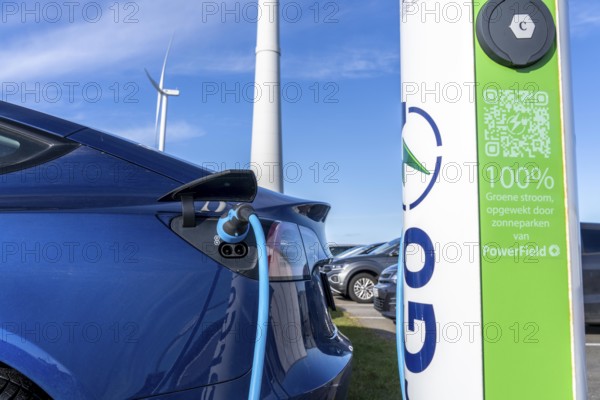 Electric car fast charging station, from the Dutch provider PowerGo, in the ferry harbour of Eemshaven, powered by renewable energy, Netherlands