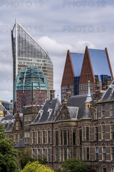 The historic Binnenhof, seat of the Dutch government, Hofvijver pond, skyline of the city centre at the central station, in the city centre of The Hague, Netherlands