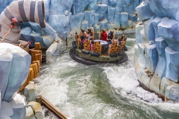 Park guests riding Popeye & Bluto's Bilge-Rat Barges in Toon Lagoon at Universal Studios Islands of Adventure in Orlando, Florida, USA, North America