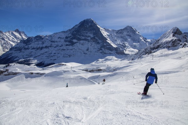 Skiing against the backdrop of the north face of the Eiger in Grindelwald, Switzerland, Europe