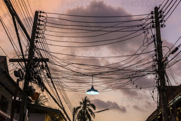 Cable, wiring, electricity, power supply, order, chaos, chaotic, electricity, electric, confusion, confusion, danger, dangerous, infrastructure, connection, chaotic, structure, thunderstorm, sky, dramatic, thunderstorm atmosphere, weather, technology, progress, supply, high voltage, dilapidated, light, lamp, power cable, lighting, Thailand, Asia