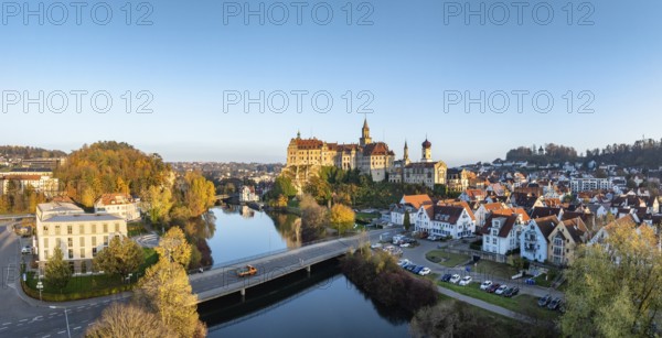 Aerial view, panorama of the town of Sigmaringen with the Hohenzollern castle, a sight and tourist attraction above the old town and the Danube with autumnal vegetation, Danube valley, district of Sigmaringen, Baden-Württemberg, Germany, Europe