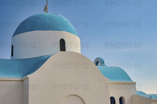 Side view of a white-blue church under a blue sky, Church of Profitis Ilias, above Nikia, Nikia, Nisyros, Dodecanese, Greek Islands, Greece, Europe