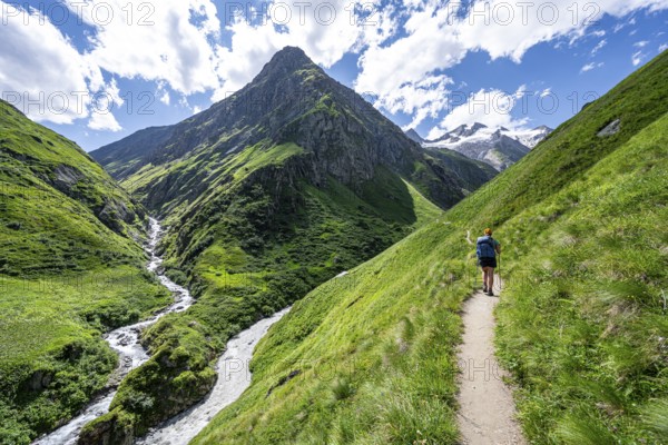 Mountaineer on a hiking trail in the Umbaltal valley, Isel and Daberbach mountain streams, Venediger Group, Hohe Tauern National Park, East Tyrol, Tyrol, Austria, Europe