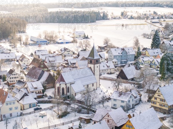 Bird's eye view of snow-covered village with central church and snow-covered roofs, Calw, Altburg, district of Calw, Black Forest, Germany, Europe