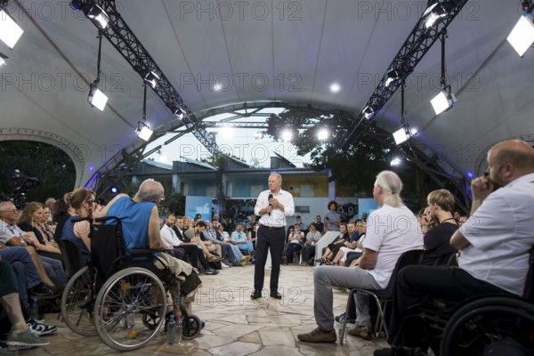 Olaf Scholz (Chancellor of the Federal Republic of Germany, SPD) surrounded by guests at the Chancellor's meeting at ufaFabrik in Berlin on 4 September 2024