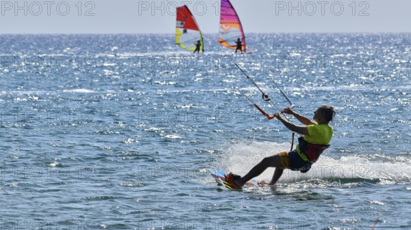 Kitesurfer rides over the sea in sunny weather, surfer's paradise, kitesurfer, windsurfer, Prasonisi, island in the south of Rhodes, Rhodes, Dodecanese, Greek Islands, Greece, Europe