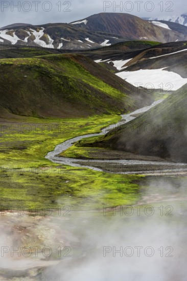 Colourful volcanic landscape with hills and snow, volcanic steaming hot springs, Laugavegur trekking trail, Landmannalaugar, Fjallabak Nature Reserve, Icelandic Highlands, Suðurland, Iceland, Europe