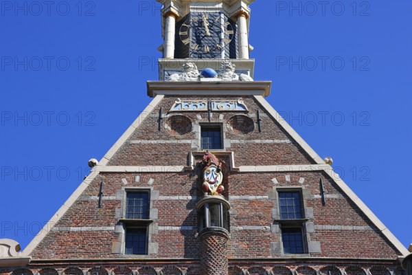 City coat of arms with unicorn and post horn on the historic Hoofdtoren defence defence tower in the harbour of Hoorn, Markermeer, part of the IJsselmeer, province of North Holland, West Friesland, Netherlands