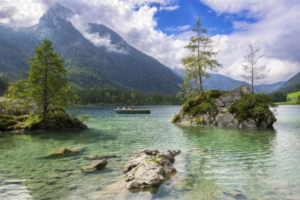 Hintersee near Ramsau with clear green water, surrounded by forests and mountains under a cloudy sky, excursion boat, Berchtesgaden National Park, Berchtesgadener Land, Upper Bavaria, Bavaria, Germany, Europe