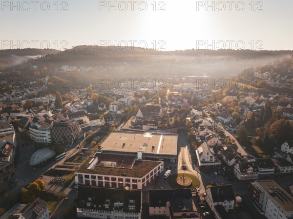 A town in daylight with surrounding hills and buildings in autumn, Nagold, Black Forest, Germany, Europe