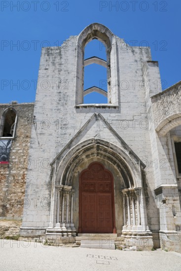 A Gothic church ruin with ornate archways standing out against the clear blue sky, Convento do Carmo, Do Carmo Monastery, Lisbon, Lisboa, Portugal, Europe