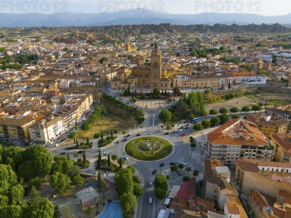 Aerial view of a city with historical centre, roundabout and surrounding landscape, mountains in the background, aerial view, cathedral, Catedral de la Encarnación de Guadix, Guadix, Sierra Nevada, Granada, Andalusia, Spain, Europe