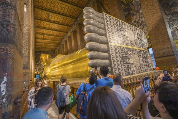 Wat Pho, temple of the reclining Buddha. Sightseeing attraction, architecturally significant temple complex. It is home to Phra Buddhasaiyas. The gilded Buddha statue is 46 metres long and 15 metres high. Bangkok, Thailand, Asia