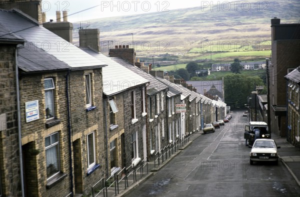 Steeply sloping street with Victorian terraced houses, Park Street, Blaenavon, Torfaen, South Wales UK 1987