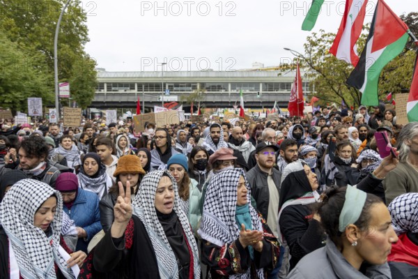 Participants in front of the Kottbusser Tor underground station at the pro-Palestinian demonstration in Berlin, Germany, 6.10.2024: Pro-Palestinian demonstrators protest at Kottbusser Tor in Berlin-Kreuzberg under the slogan Demo against genocide in Gaza on the anniversary of the attack on Israel by the radical Islamist Hamas on 7 October 2023, which killed over 1, 000 people and kidnapped hundreds in the Gaza Strip and has been at war with Israel ever since. Berlin, Europe