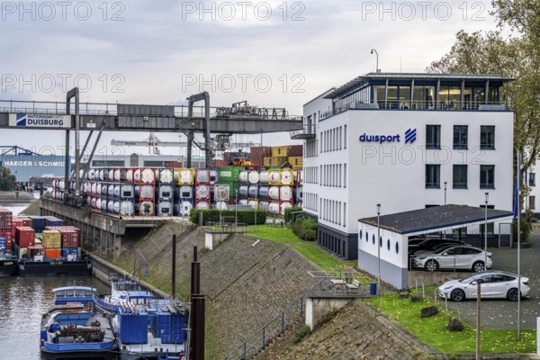 Port of Duisburg Ruhrort, container cargo ship being loaded and unloaded at DeCeTe, Duisburg Container Terminal, Duisport, administrative building of Duisburger Hafen AG, Duisburg, North Rhine-Westphalia, Germany, Europe