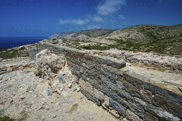 Ancient wall and ruins stretching over a hill, under a clear sky, Archaeological site, Vroulia, Wall remains, above Prasonisi, island in the south of Rhodes, Rhodes, Dodecanese, Greek Islands, Greece, Europe