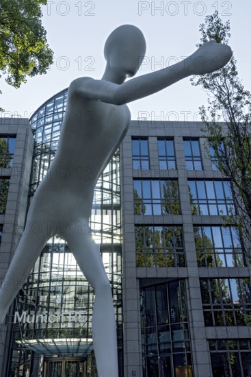 Walking Man, monumental sculpture by Jonathan Borofsky made of steel and plastic, pedestrian, walking man, human being, Munich RE insurance company, Munich Re, Leopoldstrasse, Schwabing, Munich, Upper Bavaria, Bavaria, Germany, Europe