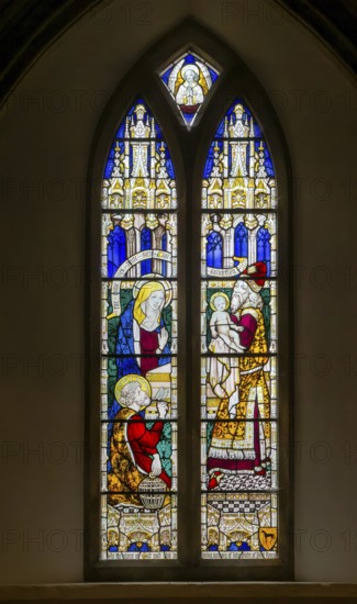 Stained glass window of Presentation in the Temple by Stanley North 1923, Church of Saint Mary, Kingsclere, Hampshire, England, UK