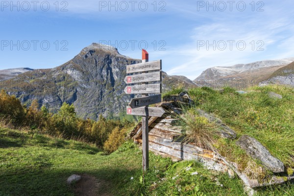 Signpost at Alpe Homlongsætra above the Geirangerfjord, traditional summer farm, Geirangerfjord, Norway, Europe