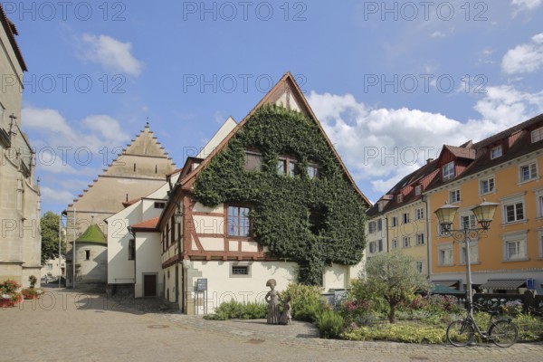 Town hall with ivy and sculpture of a woman in traditional traditional costume, Überlingen, Überlinger See, Lake Constance area, Baden-Württemberg, Germany, Europe