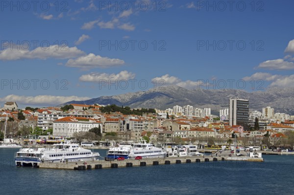 Passenger ferries and parts of the city centre, skyscrapers and mountains, Split, Dalmatia, Mediterranean Sea, Croatia, Europe