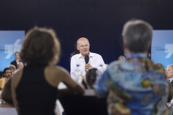 Olaf Scholz (Chancellor of the Federal Republic of Germany, SPD) surrounded by guests at the Chancellor's meeting at ufaFabrik in Berlin on 4 September 2024