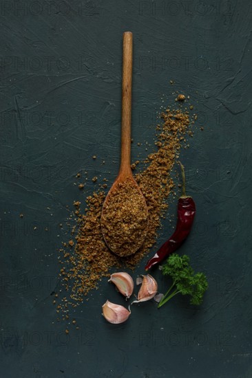 Svan salt, wooden spoon, garlic, red hot pepper, herbs and spices, Georgian cuisine