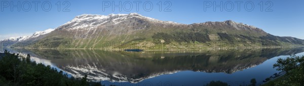 Morning sun over the Sørfjord, a branch of the Hardangerfjord, view from the apple plants at Lofthus to the western shore of the fjord, Hordaland, Norway, Europe