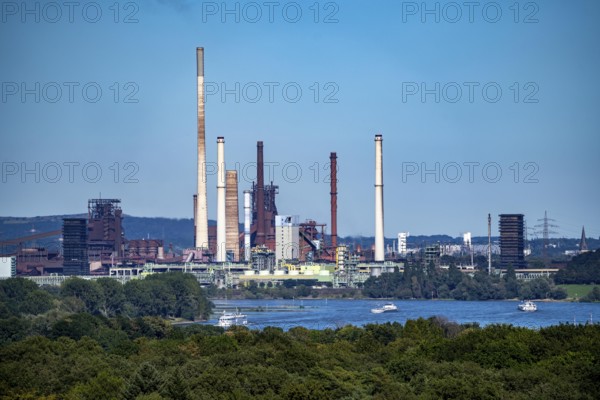 View across the Rhine to the Thyssenkrupp Steel steelworks in Duisburg-Beeckerwerth, blast furnaces, coking plant, green landscape on the left bank of the Rhine, North Rhine-Westphalia, Germany, Europe