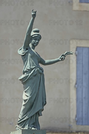 Sculpture of the allegory of the French Republic, created 1792, woman, bronze, pose, gesture, arms, up, hold, victory, Suze-la-Rousse, Drôme, Tricastin, Provence, France, Europe