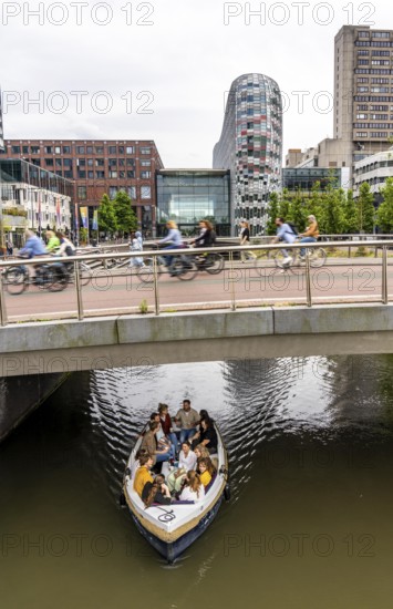 Central cycle path on the Vredenburg Viaduct, at the Hoog Catharijne shopping centre, behind Utrecht Centraal station, canal, in the centre of Utrecht, heavy traffic, Netherlands