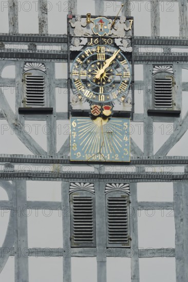 Golden clock with grey half-timbering and shutters, sundial, half-timbered house, wooden beams, grey, white, decorations, craftsmanship, date, 1630, detail, town hall, market square, Butzbach, Wetterau, Hesse, Germany, Europe