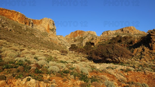 Morning light, landscape with sunny hills and rock formations under a clear blue sky, Gramvoussa peninsula, north-west Crete, Crete, Greek Islands, Greece, Europe