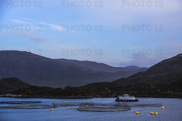 Sunset over Salmon farm in Norway, Innvikfjorden, Olden, Norway, Europe