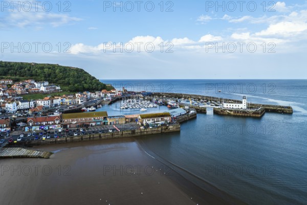 Scarborough Lighthouse and Harbour from a drone, Vincent Pier, Scarborough, North Yorkshire, England, United Kingdom, Europe