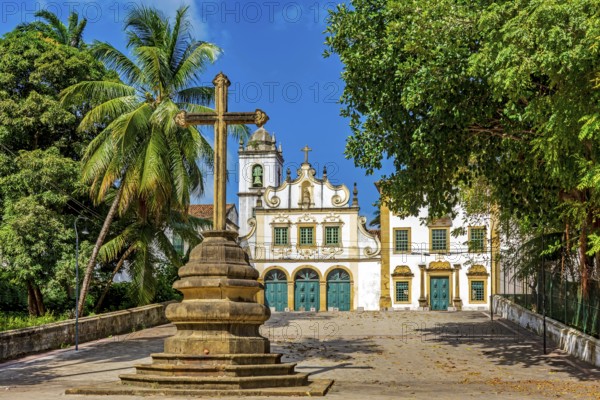 Square with historic baroque church and stone crucifix in Olinda, Pernambuco, Brazil, South America