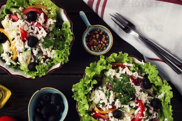 Traditional Bulgarian dish, Shopska salad, on a wooden table, salad of fresh vegetables, top view, close-up, no people, Bulgarian food, Bulgarian cuisine, salad, vegetables