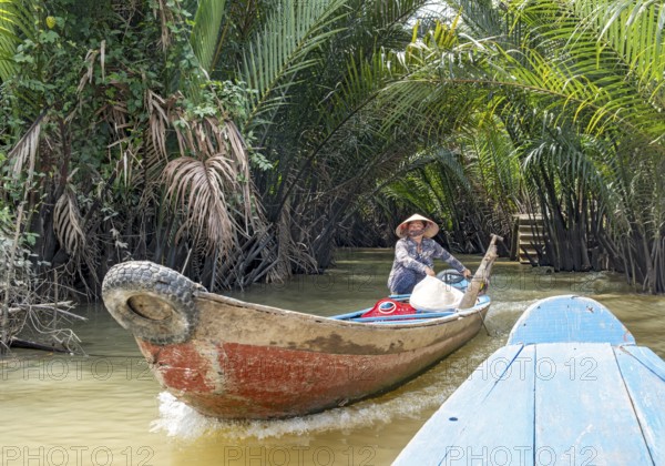 Vietnamese Woman ina rowing boat, Mekong Delta, Vietnam, Asia