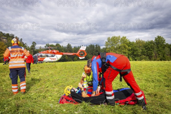 Winch rescue training of the rescue helicopter, Christoph 62, on the occasion of the 50th anniversary of the DRF Luftrettung. The rescue of casualties in the Elbe Sandstone Mountains will be practised